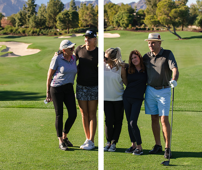 A group of people standing around each other on the golf course.